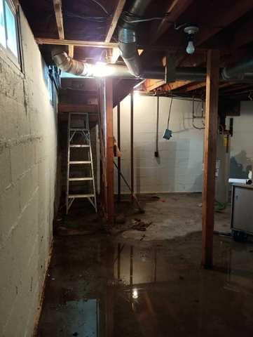 Basement in Wenatchee showing signs of flooding, needs waterproofing