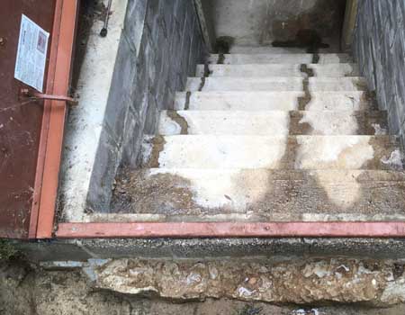 Photograph showing a hatchway door leak, highlighting the need for waterproofing solutions to prevent water damage and maintain a dry space.