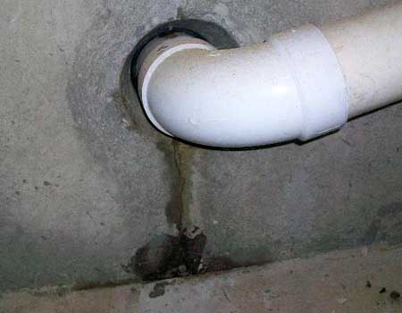 Photograph depicting leaks around pipe penetrations, emphasizing the need for waterproofing solutions to protect against water damage and ensure a dry interior.