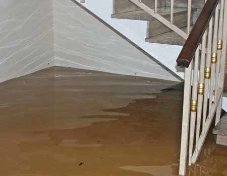 Flooded basement due to leaking walls.