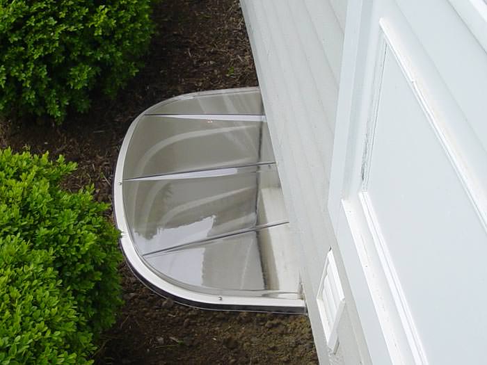 Basement window wells installed around windows for natural light and emergency egress