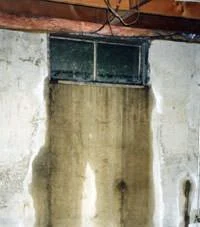 Flooding through a basement window in a home in Cataldo, ID near Old Highway 10 and Cataldo Road