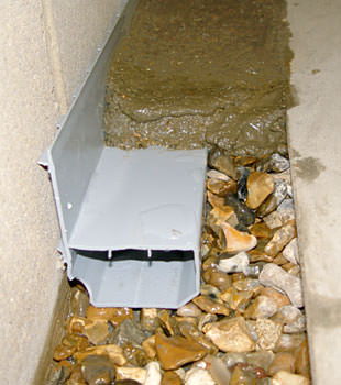 Installation of a basement drain system by Premier Basement Systems in Sandpoint, ID near Hwy 95 and 5th Ave