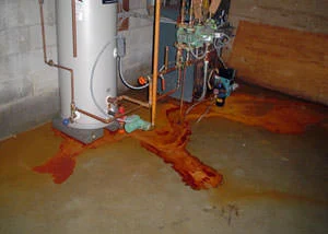 Iron ochre bacteria causing flooding in a basement, with visible orange staining and water damage in a home in Rathdrum near Main Street