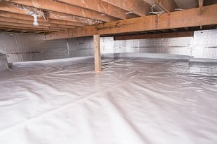 Installing crawl space moisture barrier in Liberty Lake property