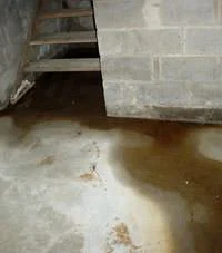 Stair flooding issue in a home in Osburn, ID near Main Street and 1st Avenue