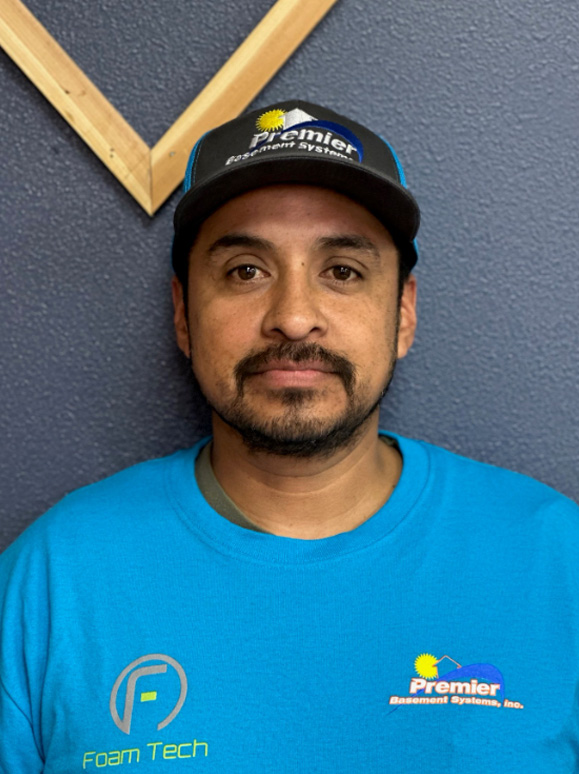 Arturo Lopez, co-foreman at Premier Basement Systems, standing proudly with his team, ready to tackle projects.