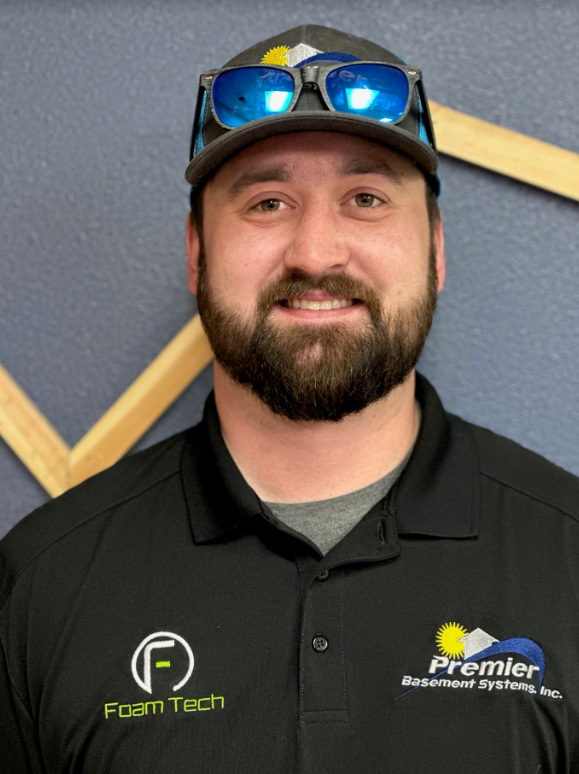 Meet the team: Logan Hilding, foreman at Premier Basement Systems, overseeing a construction site with determination and expertise.